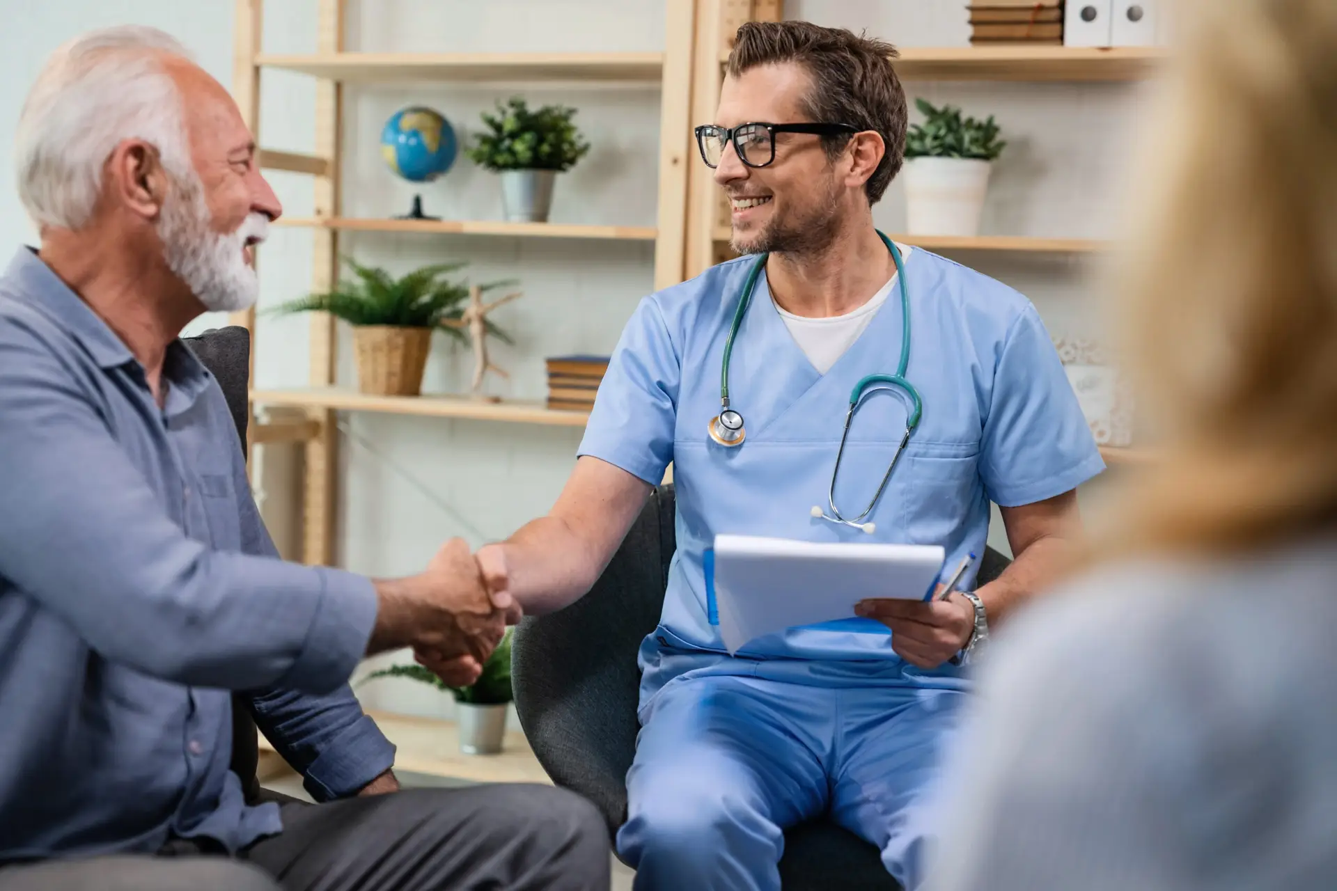 A healthcare professional speaking with a patient