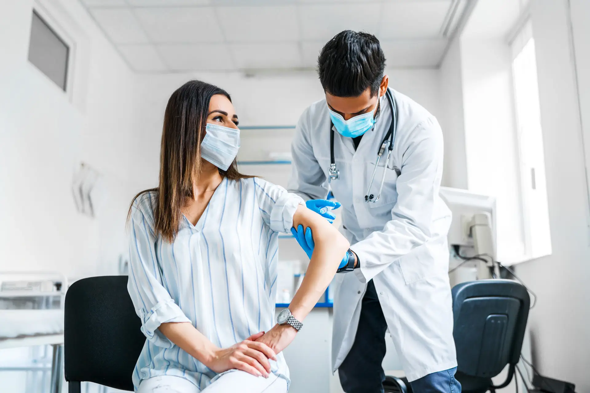 Clinician carefully administering a treatment